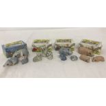 4 sets of Wade ceramic Happy Families figurines in original boxes.