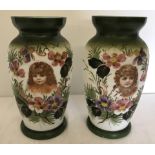 A pair of Victorian milk glass vases with hand painted decoration and transfer decoration.