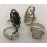 4 silver ladies dress rings to include stone set.