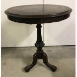 A small vintage tripod based occasional table with carved decoration to pedestal base.
