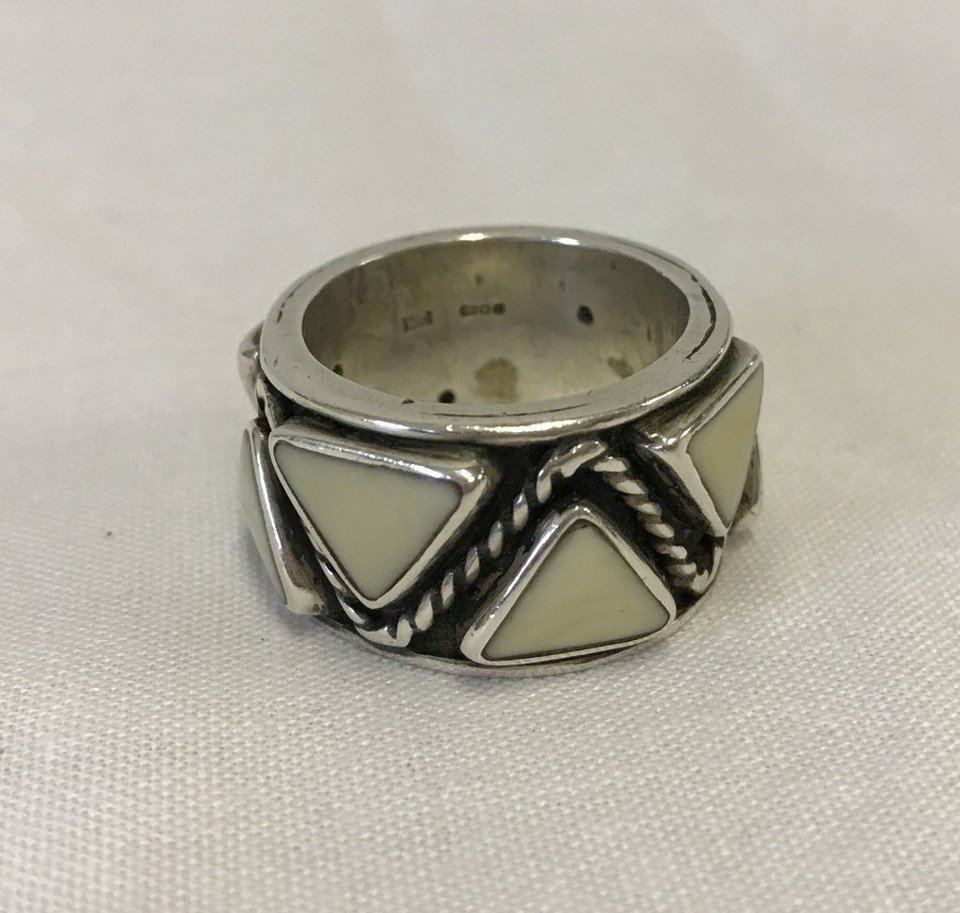 A heavy hallmarked silver ring with triangle design.