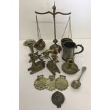 A small collection of brass and pewter items.