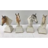4 Royal Worcester painted horses heads on plinths.