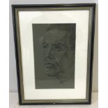 A framed and glazed pastel monochrome portrait.