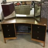 A vintage curve fronted 6 drawer double pedestal dressing table with triple adjustable mirror.