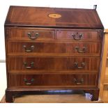 A vintage solid wood 5 drawer bureau with inlay detail.