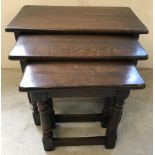 A nest of 3 Old Charm style oak tables.