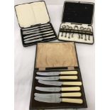 A boxed set of silver handled butter knives with cased EPNS tea spoons and faux ivory butter knives.