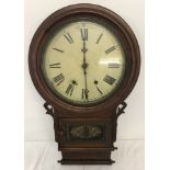 A vintage wooden cased wall hanging clock.
