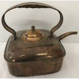 An unusual square shaped copper kettle.