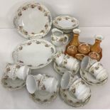 A Victorian ceramic tea set together with a German ceramic orange lustre dressing table set.