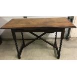 A vintage dark wood hall / console table with barley twist legs and x frame.
