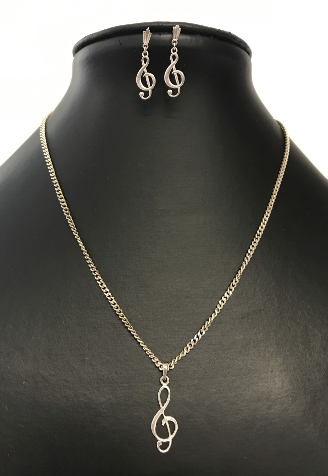 A silver pendant chain and earrings set with 'treble clef' design.