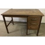 A vintage oak, single pedestal, 3 drawer desk.