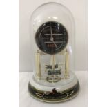 A Bradford Exchange "Legend of Locomotion Anniversary Clock" dome clock.