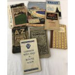 A quantity of vintage motoring booklets together with a selection of vintage London maps.