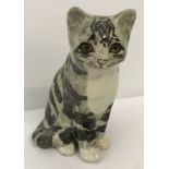 A size 3 Winstanley grey tabby kitten in sitting position.