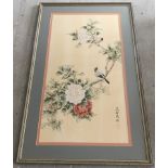 A framed and glazed oriental watercolour on silk of Birds on a flowered branch.