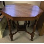 An mahogany octagonal topped occasional table.