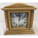 A modern Quartz Westminster chime wooden cased mantle clock.