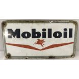 A small vintage enamel Mobil oil sign.
