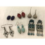 6 pairs of large silver/white metal earrings.