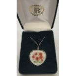 A boxed Bradford Exchange crystal heart shaped pendant with poppy decoration on 925 silver chain.