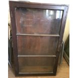 A mahogany glass fronted cabinet.