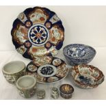 A small collection of oriental ceramics to include plates, bowls and lidded pots.