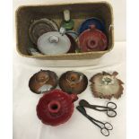 A collection of vintage enamelled and ceramic candlestick holders.