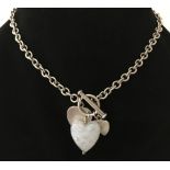 A silver belcher style chain necklace with T bar fixing and heart shaped glass bead pendant.