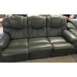 A green leather 3 seater settee with padded seats.