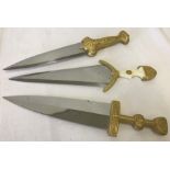3 reproduction ornamental knives with gold tone handles.