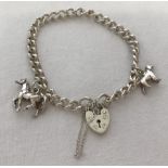 A modern silver charm bracelet with padlock and safety chain with 2 charms, a horse and a dog.