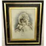 A framed and glazed Victorian photograph of a baby printed onto ceramic tile.