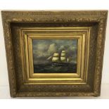 A framed oil on board of a ship, signed to lower right.