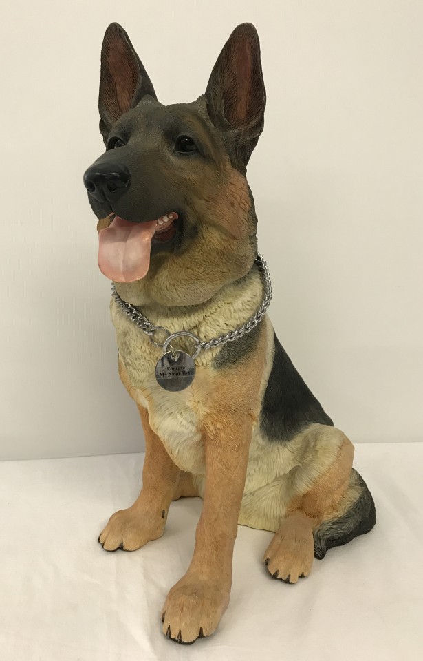 A large resin Alsatian dog figurine by Barkers.