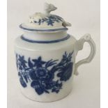 A Caughley lidded mustard pot with three flowers pattern and decorative flower finial to lid.
