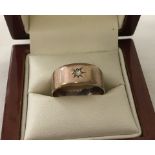 Vintage 9ct rose gold band ring set with a small diamond with 'star' setting.