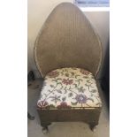 A gold loom style bedroom chair with shaped back and drawer to base.