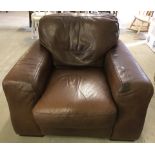 A brown leather armchair by Sofitalia.