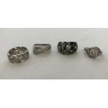 4 modern silver dress rings. All stone set.