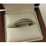 9ct gold eternity ring set with clear stones.