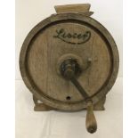 A vintage Lister light wood butter churn with front turning handle.