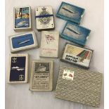 A quantity of advertising packs of playing cards from airlines and shipping companies.