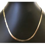 Collar style yellow gold necklace.