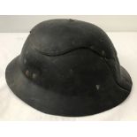 A British WWII fire watchers helmet made from fibre.
