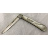 A silver blade fruit knife with mother of pearl handle and empty cartouche.