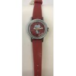 A vintage Timex Snoopy by Schultz wristwatch with original red plastic strap.