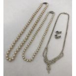 2 sets of vintage champagne faux pearls, one with a silver clasp.